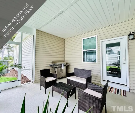 a living room filled with furniture and a potted plant
