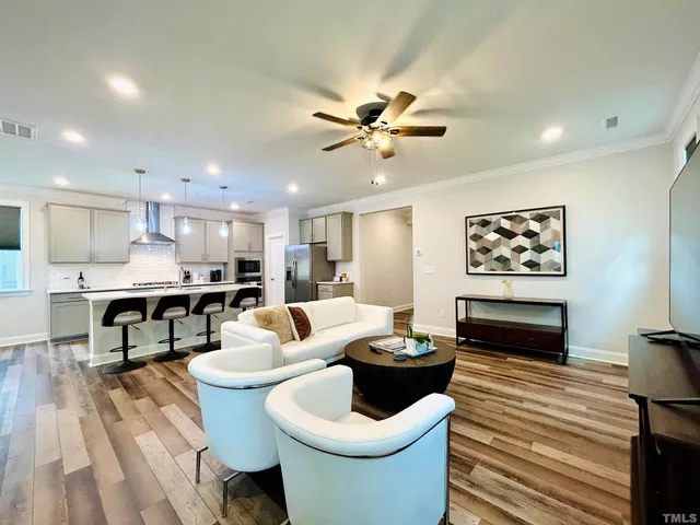 a living room with kitchen furniture and a kitchen view