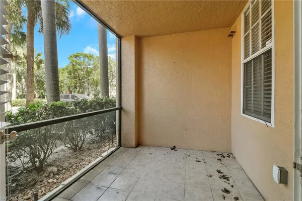 a view of balcony with a yard