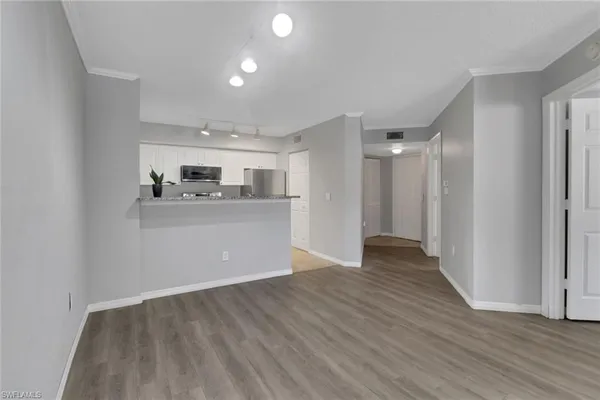 a view of kitchen with wooden floor