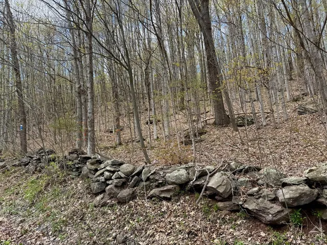 a sign on a brick wall