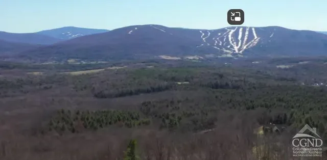 a view of mountain with lake view