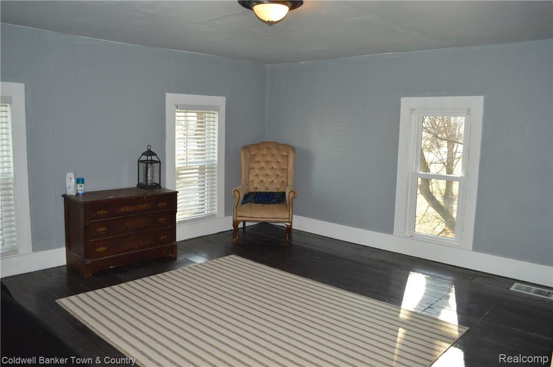 7575 North Fowlerville Road Fowlerville, MI 48836 - Photo 22 of 34 Upstairs Large Bedroom