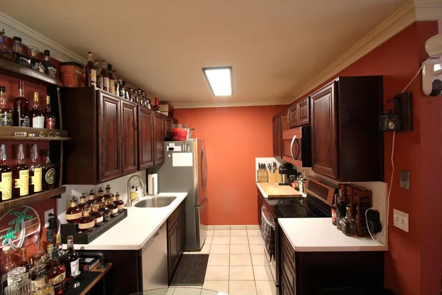 a view of a kitchen area with furniture and staircase