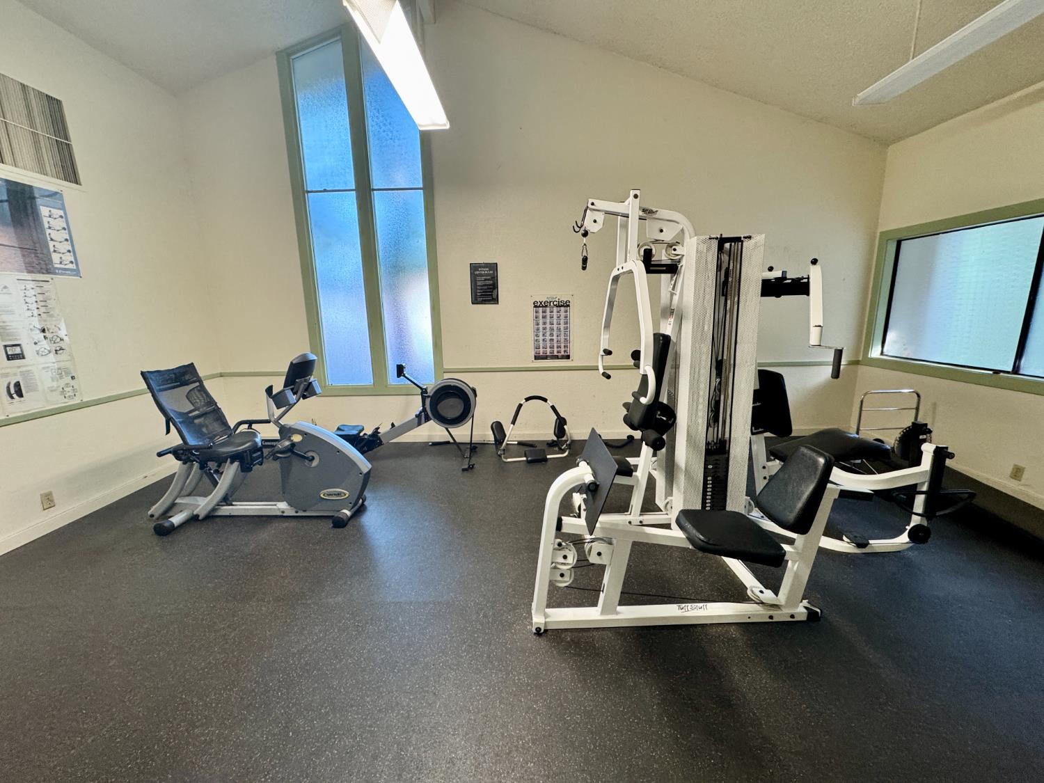 1457 Marchbanks Drive, Unit 1 Walnut Creek, CA 94598 - Photo 9 of 13 a room with gym equipment and a large mirror
