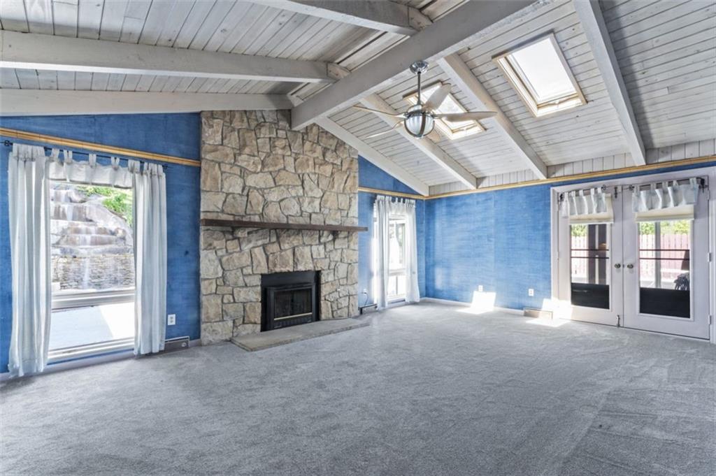106 Sunset Street McKees Rocks, PA 15136 - Photo 14 of 45 a view of an empty room with a fireplace and a window