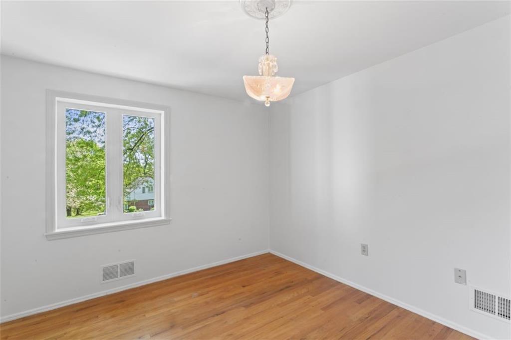 106 Sunset Street McKees Rocks, PA 15136 - Photo 16 of 45 a view of a room with a window and wooden floor