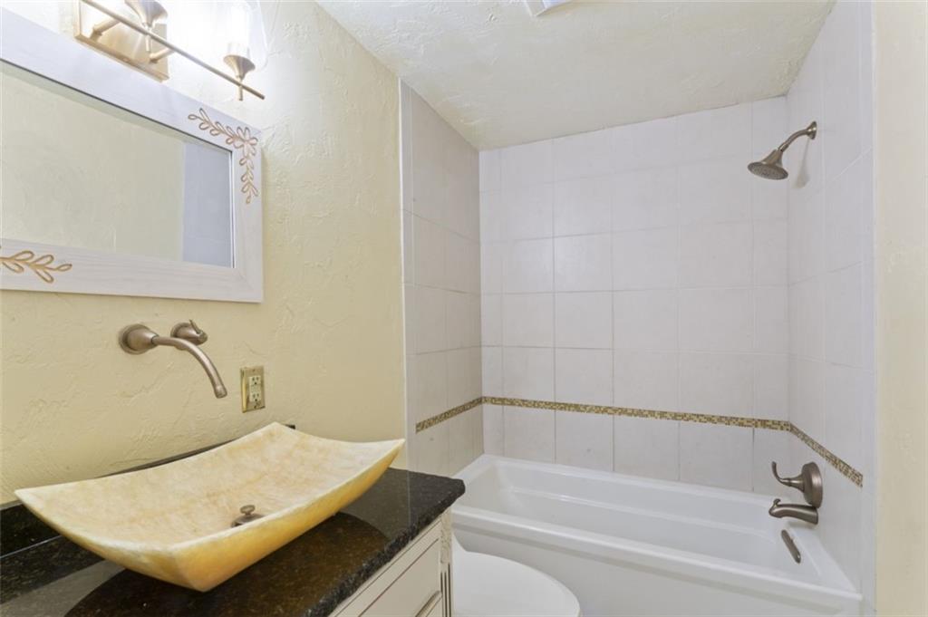 106 Sunset Street McKees Rocks, PA 15136 - Photo 19 of 45 a bathroom with a tub and sink