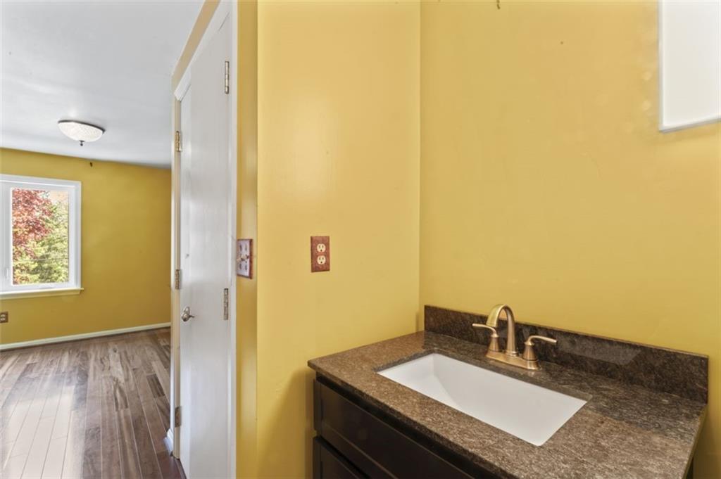 106 Sunset Street McKees Rocks, PA 15136 - Photo 20 of 45 a bathroom with a sink and a mirror