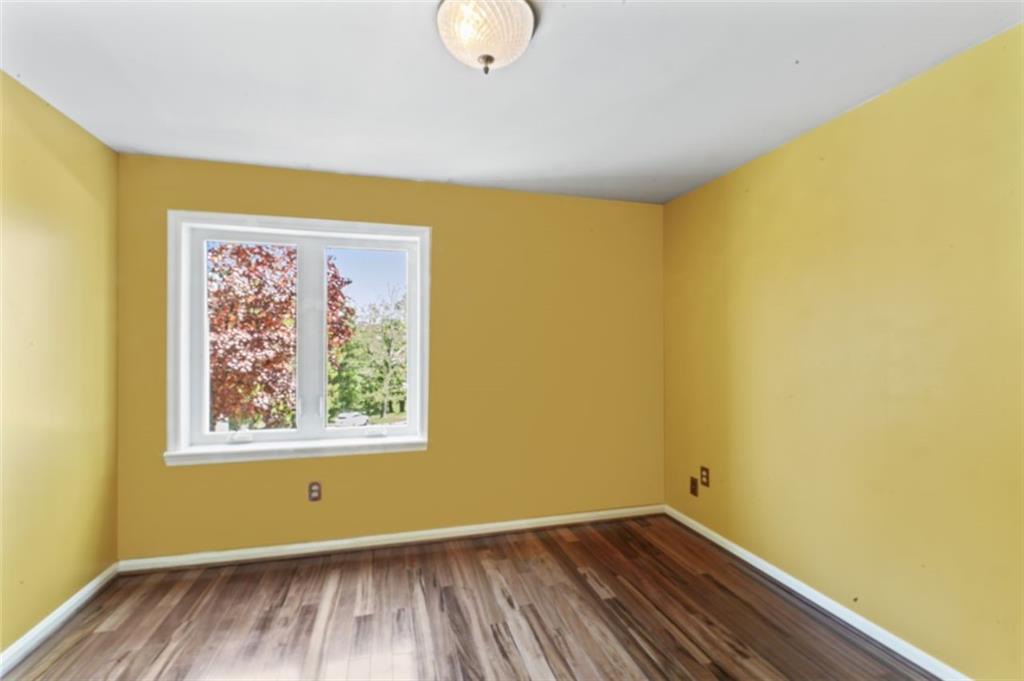 106 Sunset Street McKees Rocks, PA 15136 - Photo 21 of 45 a view of a room with wooden floor and small window