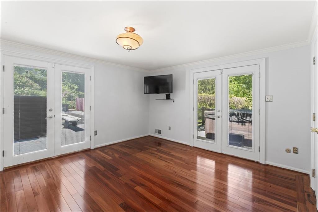106 Sunset Street McKees Rocks, PA 15136 - Photo 23 of 45 a view of an empty room with wooden floor and a window
