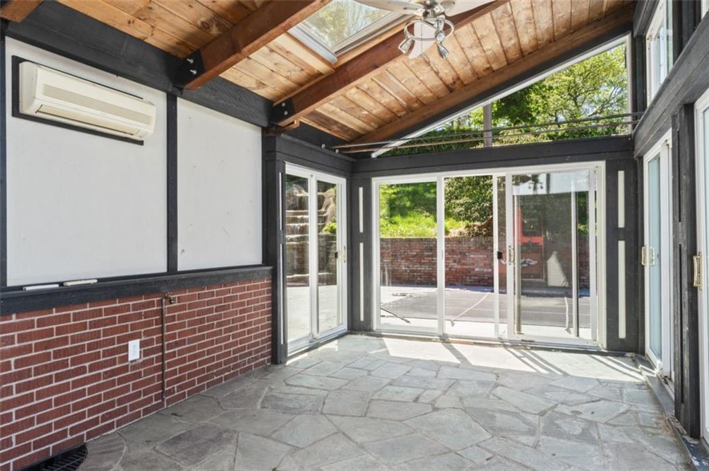 106 Sunset Street McKees Rocks, PA 15136 - Photo 38 of 45 a view of a porch with a floor to ceiling window