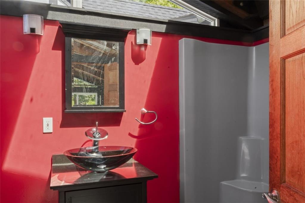 106 Sunset Street McKees Rocks, PA 15136 - Photo 43 of 45 a bathroom with a sink and a mirror