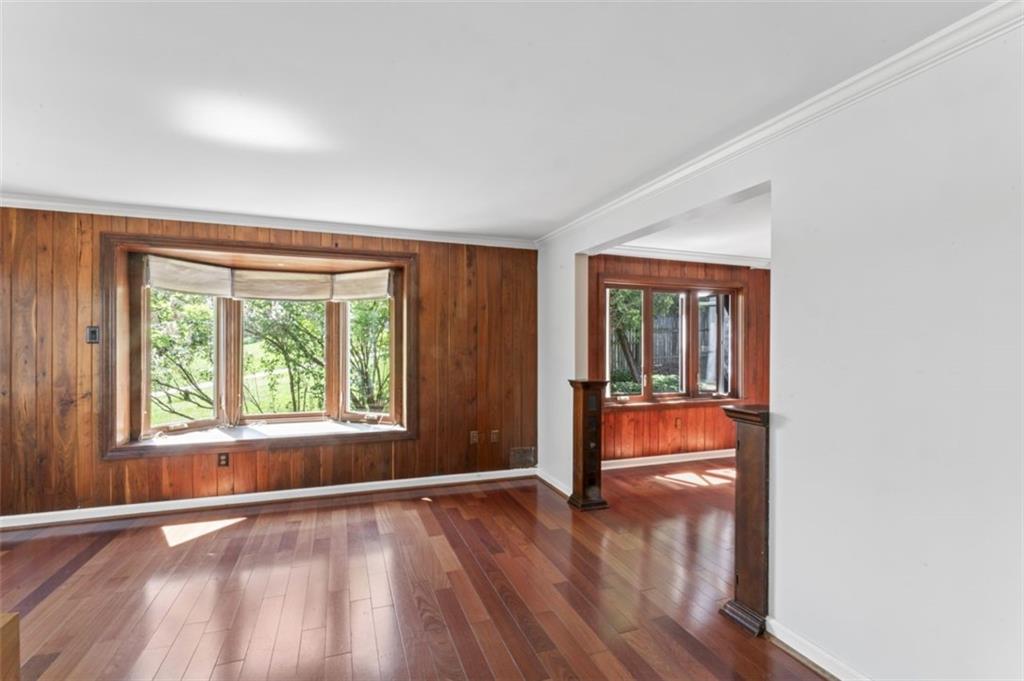 106 Sunset Street McKees Rocks, PA 15136 - Photo 7 of 45 an empty room with wooden floor and a window