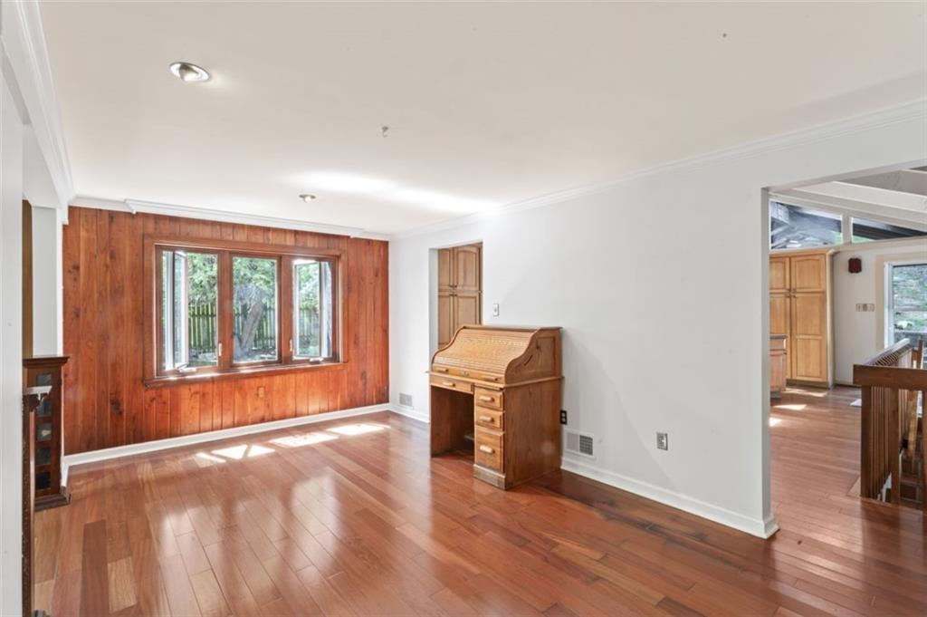 106 Sunset Street McKees Rocks, PA 15136 - Photo 10 of 45 an empty room with wooden floor and windows