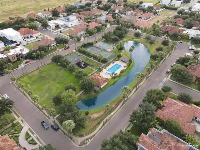 an aerial view of a residential houses with outdoor space