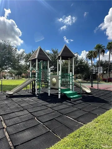 a view of a house with backyard and porch