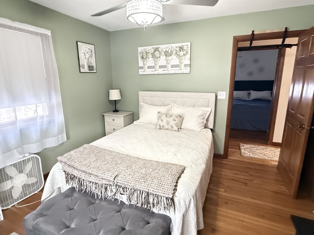 2 Blacksnake Road Salisbury, MA 01952 - Photo 19 of 31 a bedroom with a bed and wooden floor