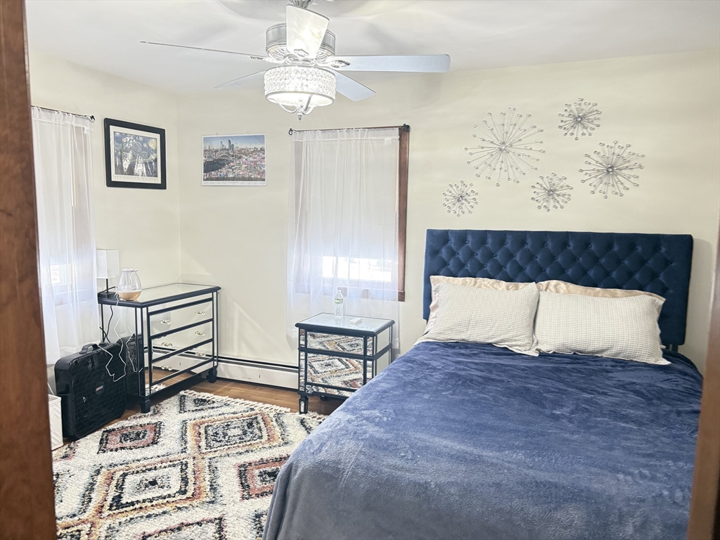 2 Blacksnake Road Salisbury, MA 01952 - Photo 22 of 31 a large bed sitting in a bedroom next to a window with balcony