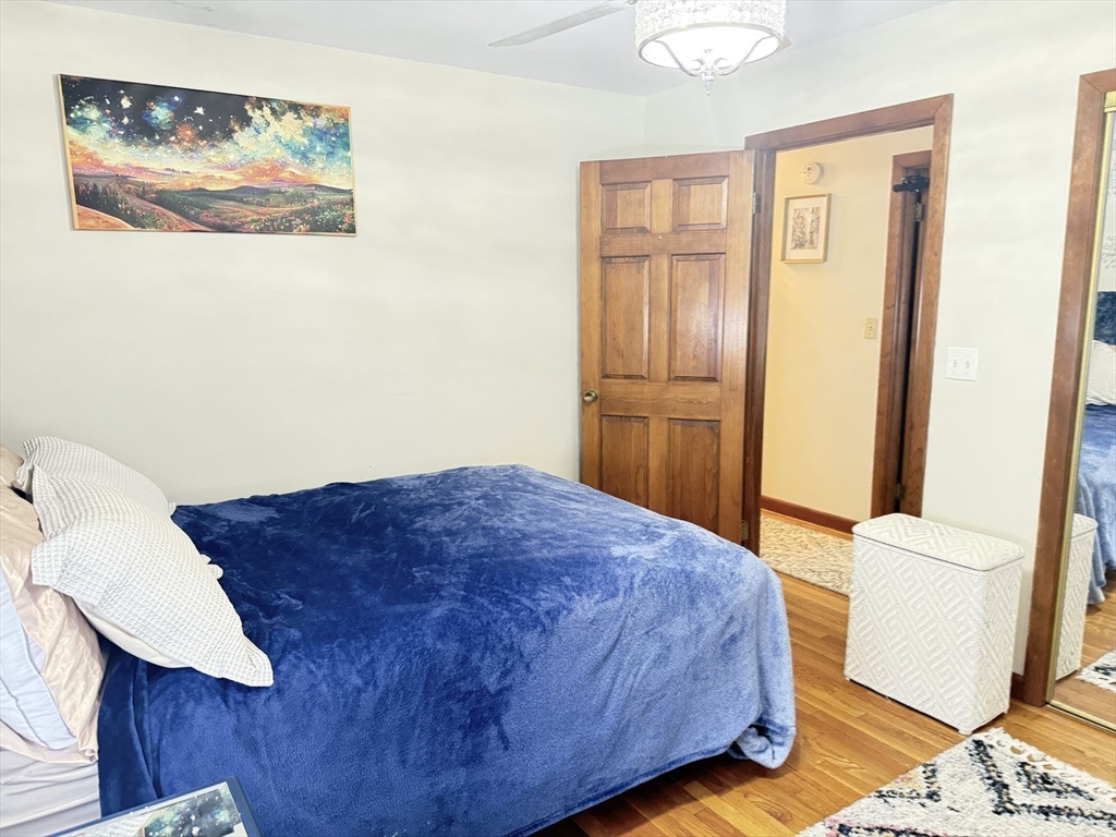 2 Blacksnake Road Salisbury, MA 01952 - Photo 25 of 31 a bedroom with a bed and cabinets
