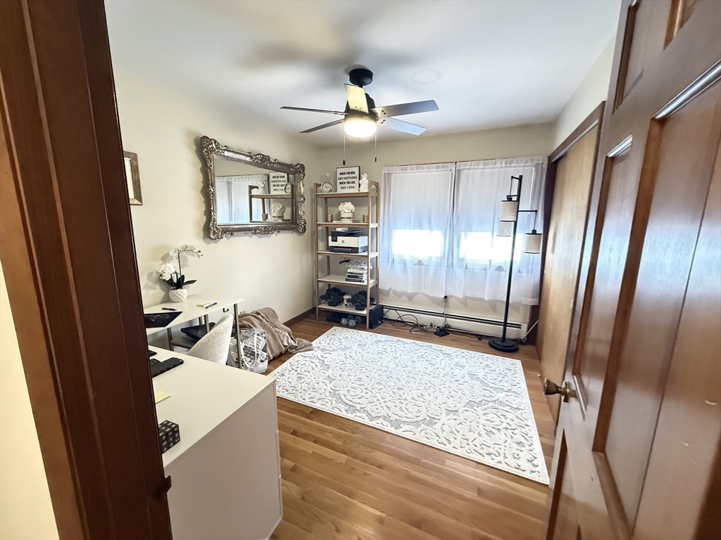 2 Blacksnake Road Salisbury, MA 01952 - Photo 26 of 31 a living room with table chairs and a refrigerator
