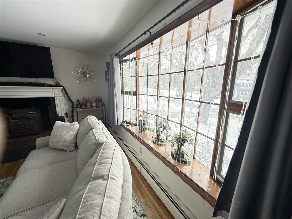 2 Blacksnake Road Salisbury, MA 01952 - Photo 7 of 31 a living room with furniture tv and a fireplace