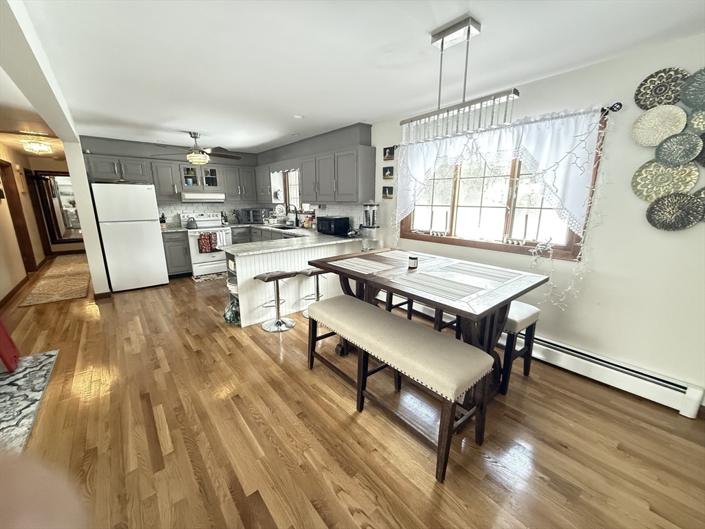 2 Blacksnake Road Salisbury, MA 01952 - Photo 8 of 31 a living room with furniture a table and white walls