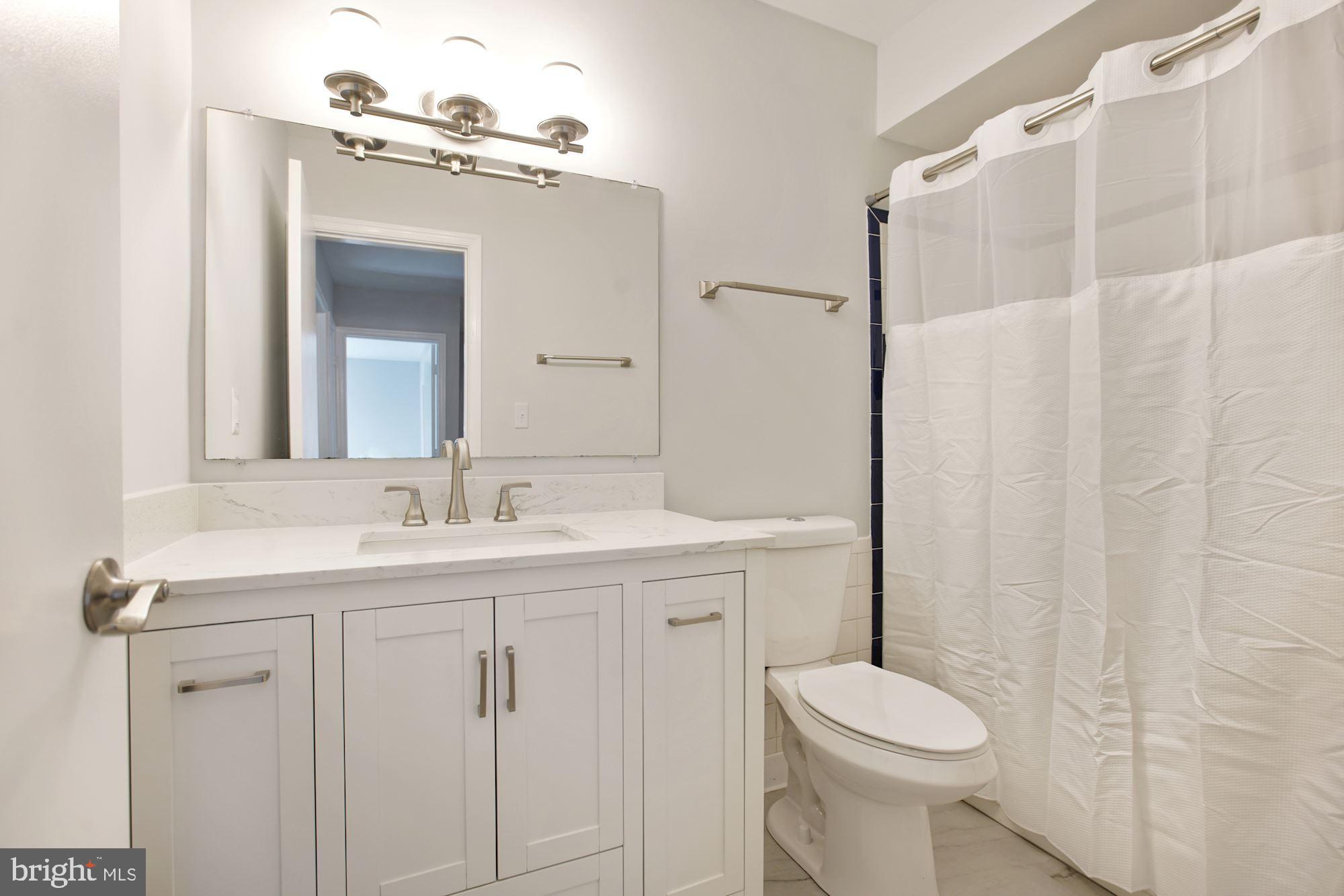 6002 Waterbury Court Springfield, VA 22152 - Photo 24 of 31 Hall Bathroom with new flooring and toilet