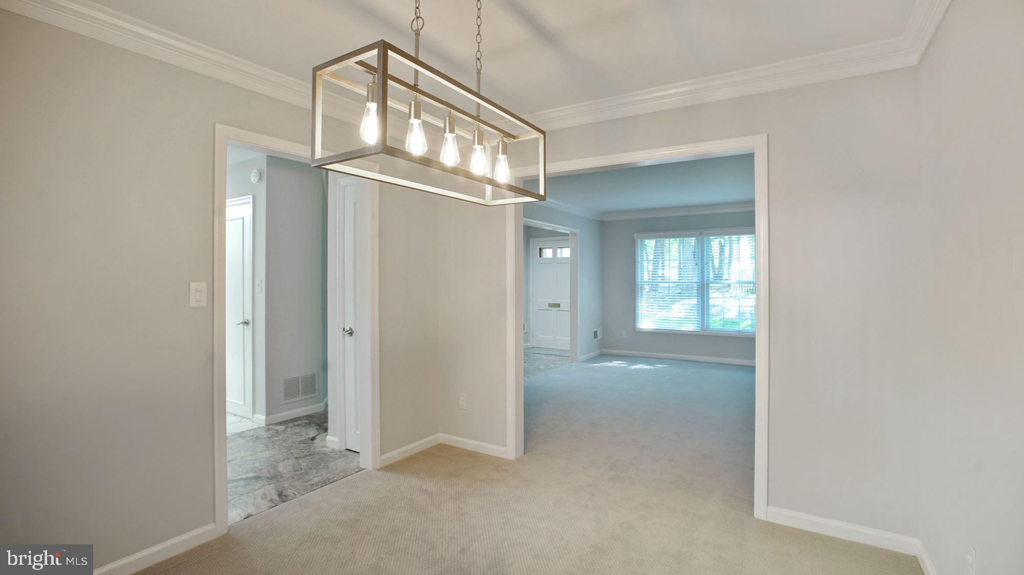 6002 Waterbury Court Springfield, VA 22152 - Photo 6 of 31 Modern lighting in the Dining Room & crown molding