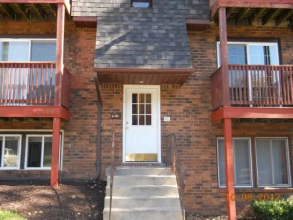 a front view of a house with glass windows