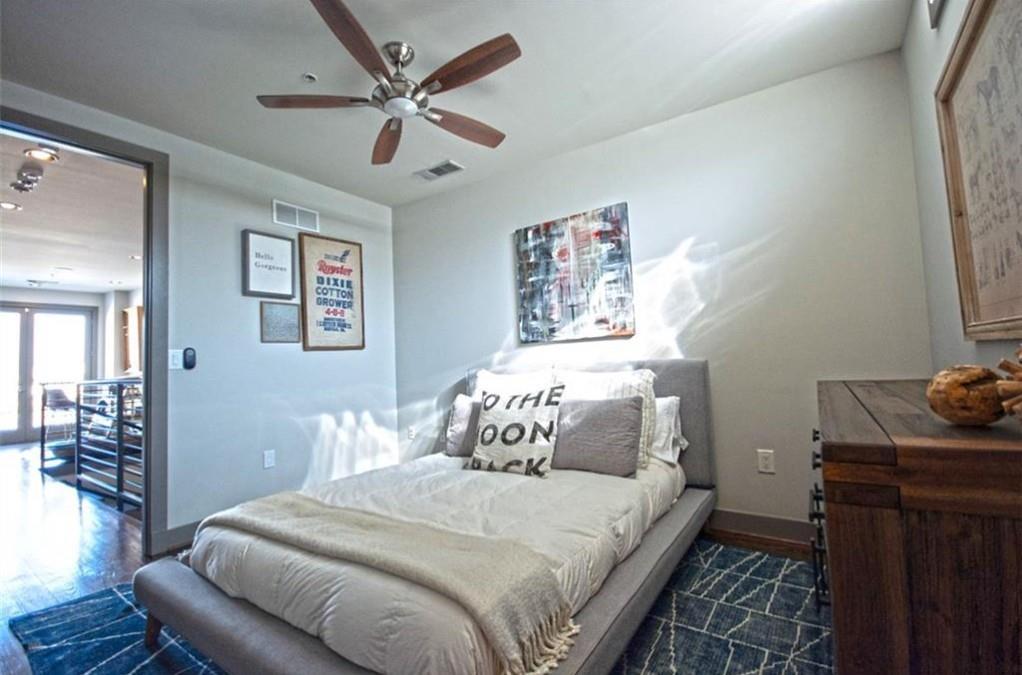 320 Peters Street Southwest, Unit 10 Atlanta, GA 30313 - Photo 14 of 20 a bedroom with bed and wooden floor