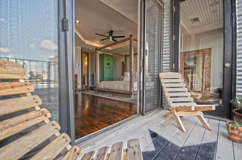 320 Peters Street Southwest, Unit 10 Atlanta, GA 30313 - Photo 17 of 20 a view of a balcony with chairs and front door