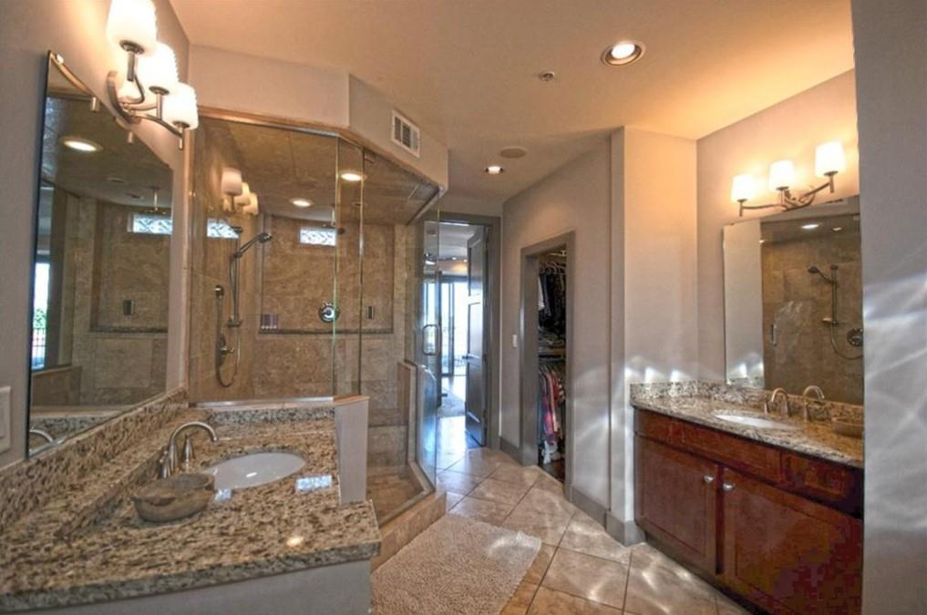 320 Peters Street Southwest, Unit 10 Atlanta, GA 30313 - Photo 19 of 20 a bathroom with a sink a large mirror and a shower