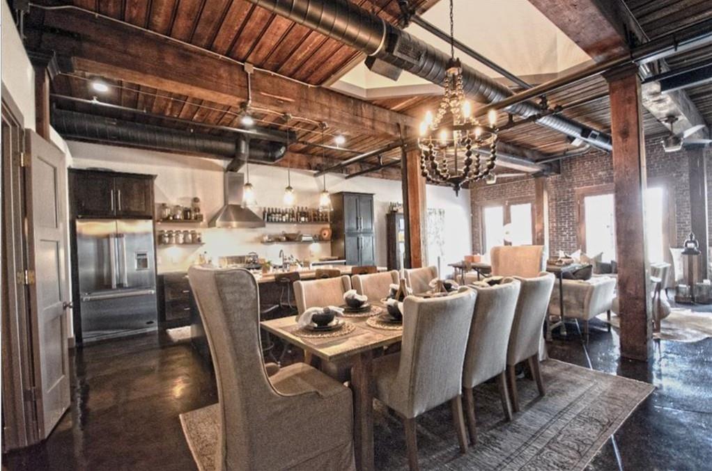 320 Peters Street Southwest, Unit 10 Atlanta, GA 30313 - Photo 3 of 20 a view of a dining room with furniture a chandelier and wooden floor