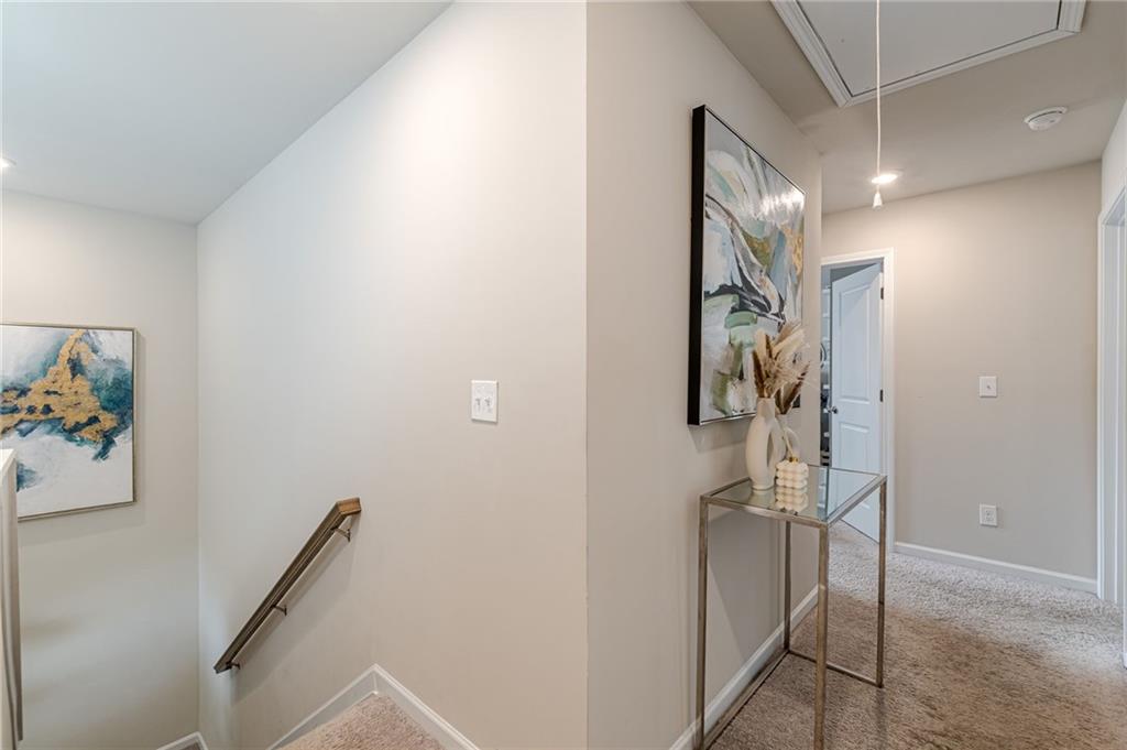 7425 Faith Street Fairburn, GA 30213 - Photo 12 of 29 a bathroom with a shower and a sink