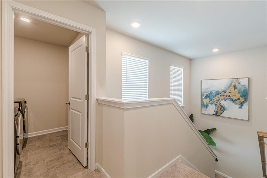 7425 Faith Street Fairburn, GA 30213 - Photo 13 of 29 a view of a hallway with a bedroom