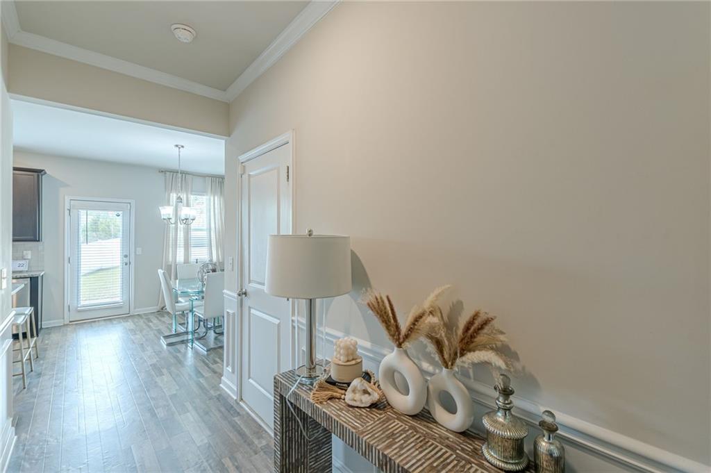 7425 Faith Street Fairburn, GA 30213 - Photo 5 of 29 a living room with furniture and wooden floor