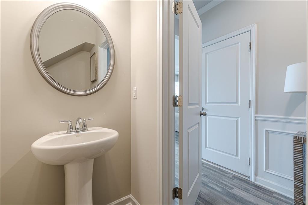 7425 Faith Street Fairburn, GA 30213 - Photo 6 of 29 a bathroom with a sink and a mirror