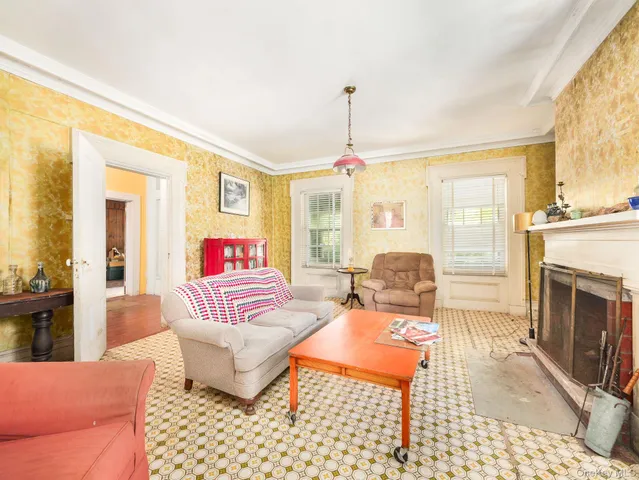a bedroom with furniture and a fireplace