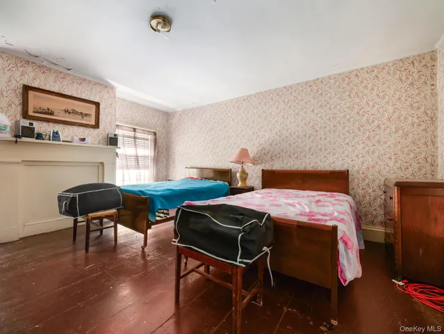 a bedroom with a bed and a chair