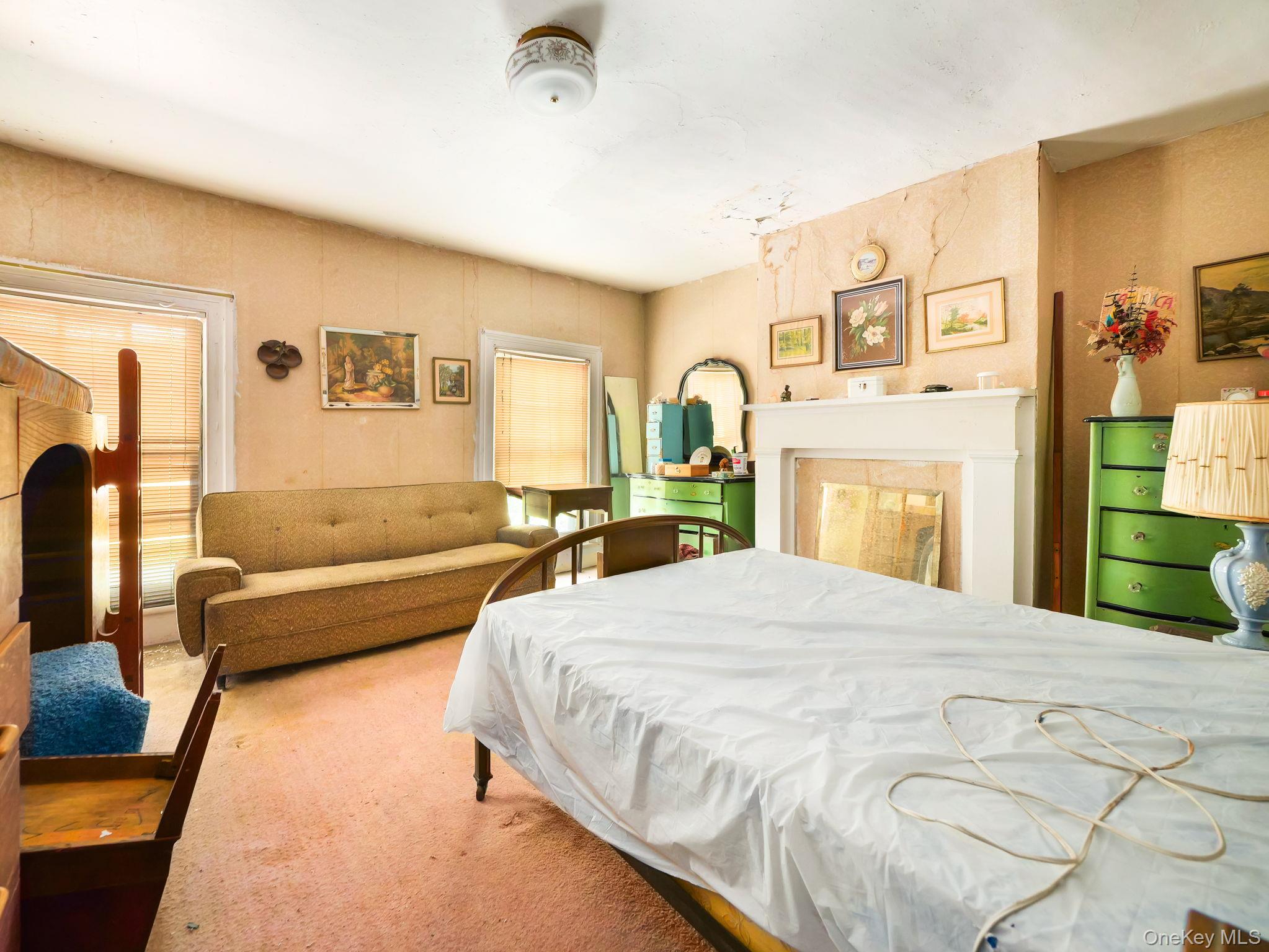 19 Oakland Valley Road Cuddebackville, NY 12729 - Photo 21 of 30 a spacious bedroom with a bed a couch and dresser