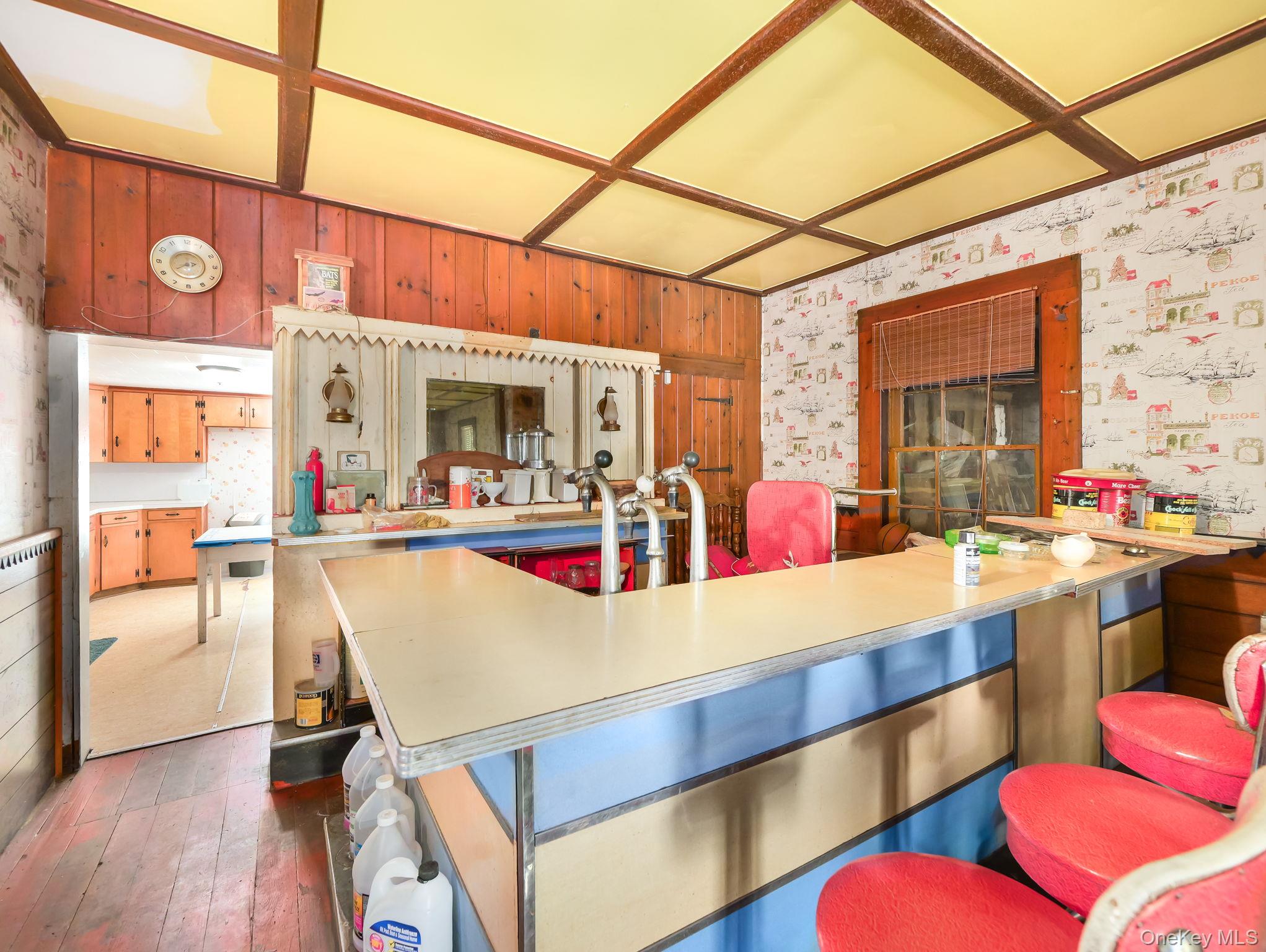 19 Oakland Valley Road Cuddebackville, NY 12729 - Photo 26 of 30 a view of a room with chairs and kitchen view