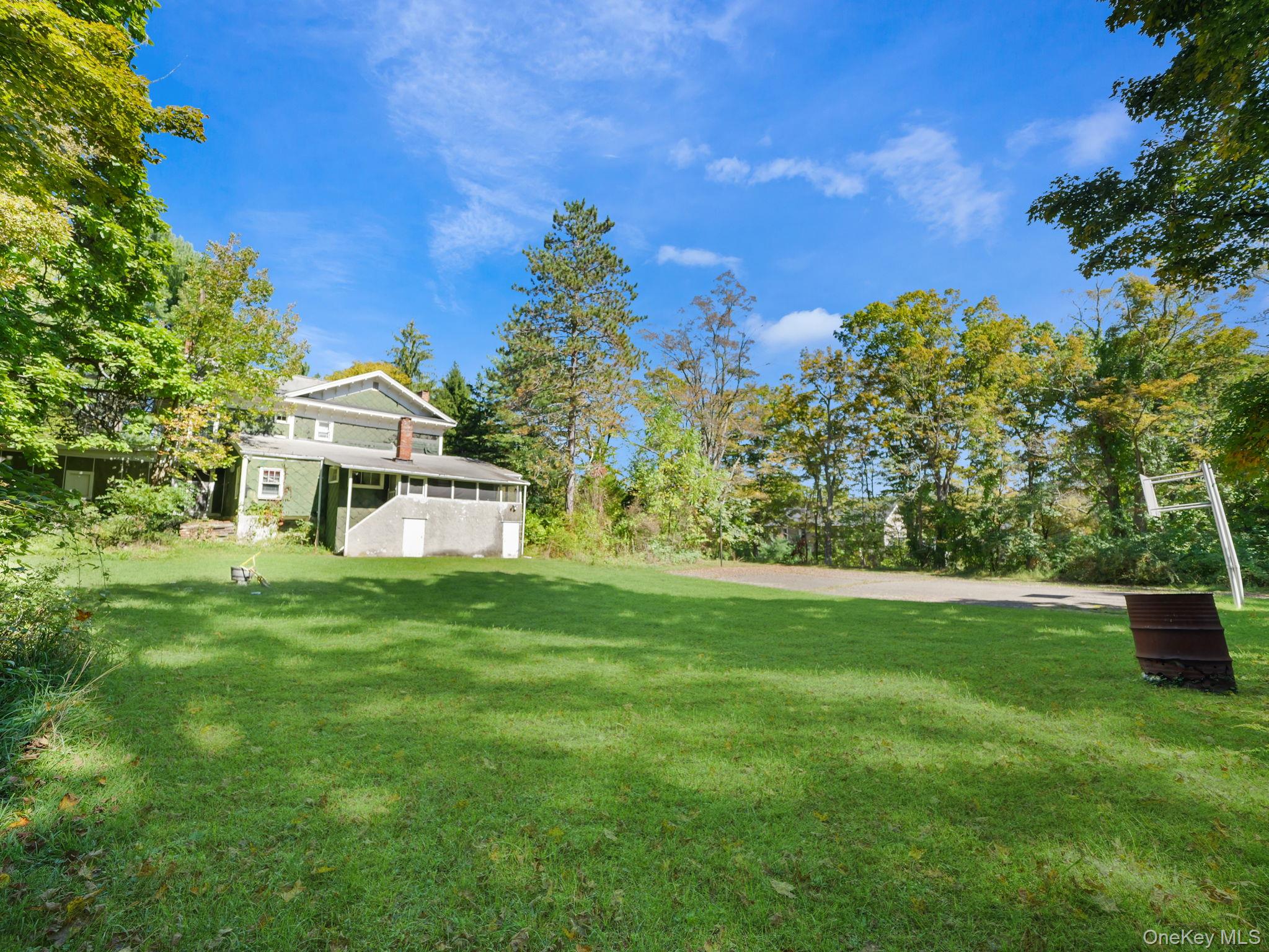 19 Oakland Valley Road Cuddebackville, NY 12729 - Photo 28 of 30 a front view of a house with a garden