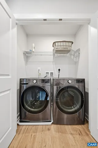 a kitchen with cabinets appliances a sink and a counter top space