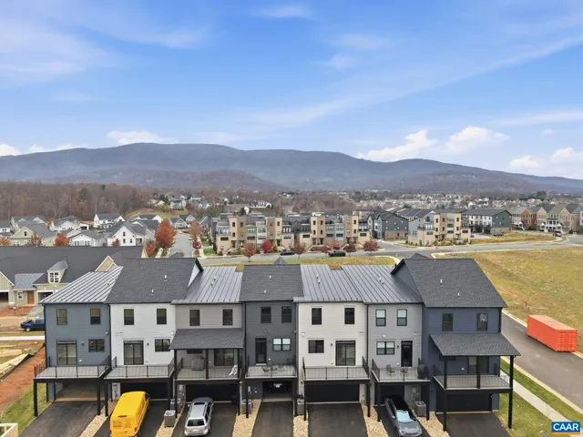 a view of a city with mountains in the background