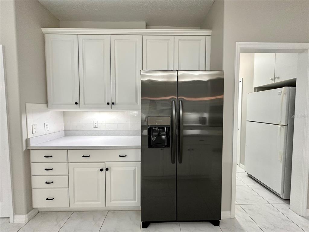 16 Westbrook Lane Palm Coast, FL 32164 - Photo 14 of 42 a kitchen with cabinets and stainless steel appliances