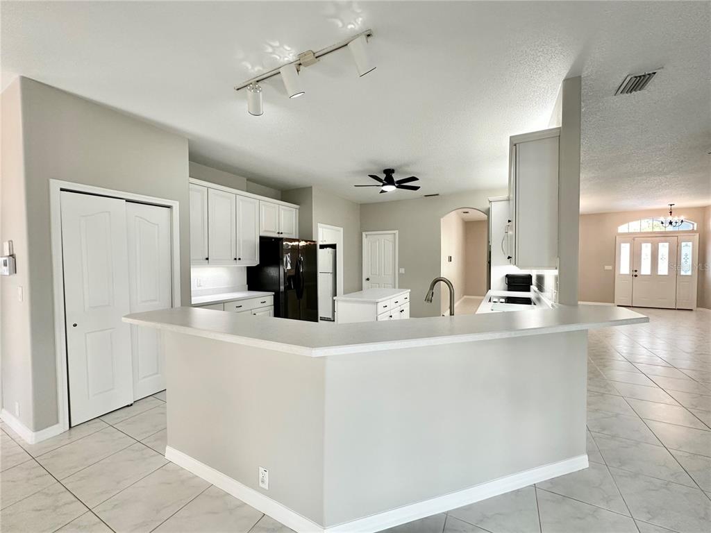 16 Westbrook Lane Palm Coast, FL 32164 - Photo 15 of 42 a kitchen with stainless steel appliances granite countertop a sink and a refrigerator