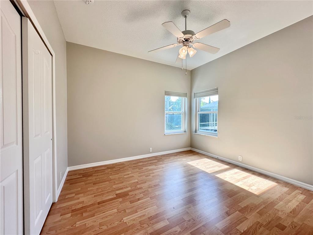 16 Westbrook Lane Palm Coast, FL 32164 - Photo 31 of 42 a view of an empty room with a window and wooden floor