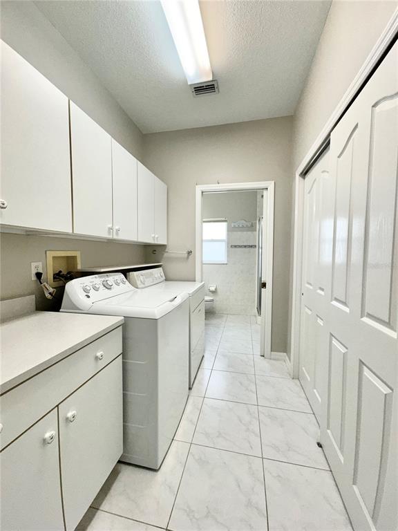 16 Westbrook Lane Palm Coast, FL 32164 - Photo 33 of 42 a kitchen with a cabinets and white appliances