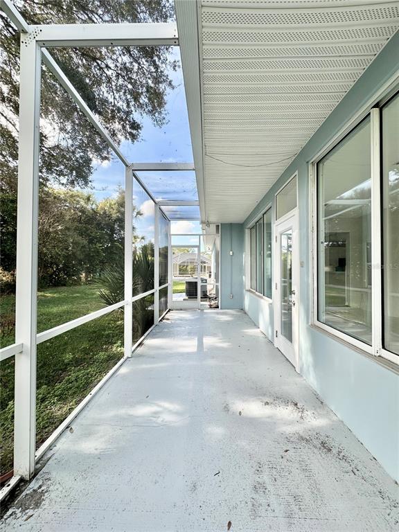 16 Westbrook Lane Palm Coast, FL 32164 - Photo 35 of 42 a view of a porch with wooden floor and fence